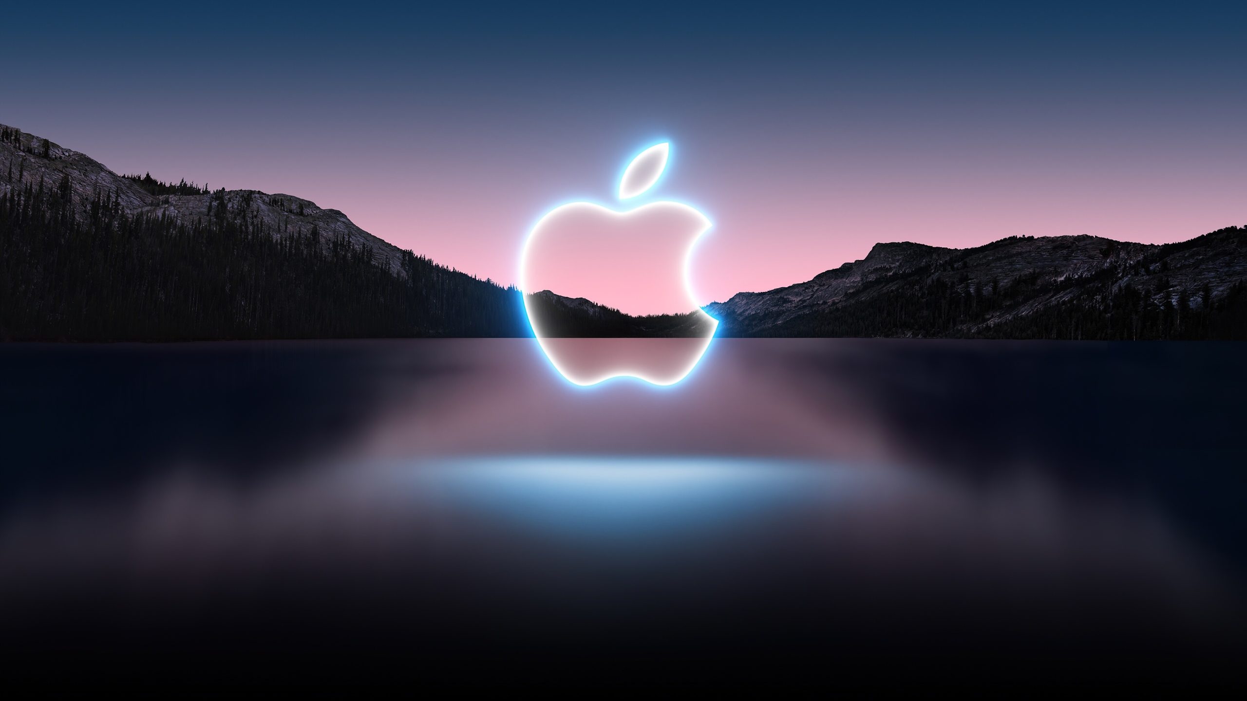 apple logo with a lake in the background