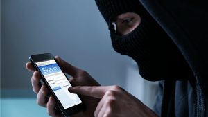 hacker stealing login on smartphone