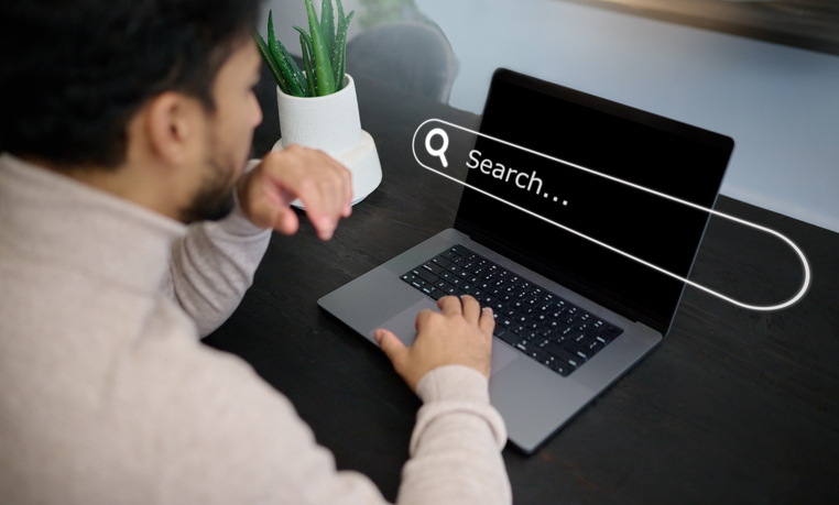 hands and laptop hologram with search engine